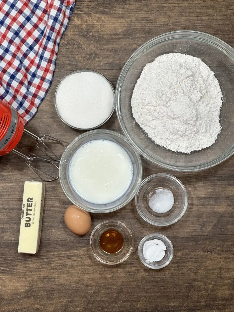 Ingredients on the table, including a electric handheld mixer